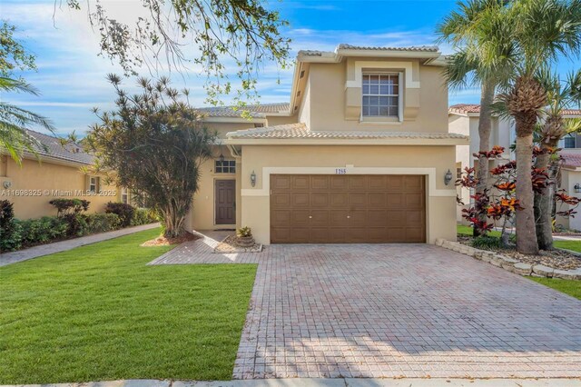 mediterranean / spanish-style home with a front yard and a garage