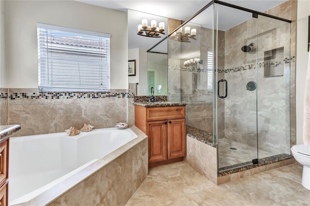 full bathroom with vanity, toilet, and shower with separate bathtub