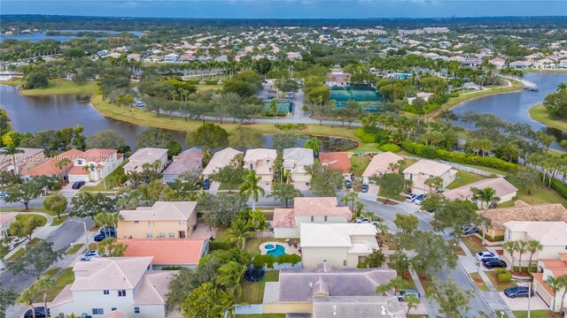 birds eye view of property with a water view