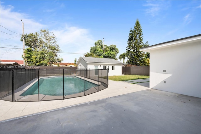 view of swimming pool with a patio area