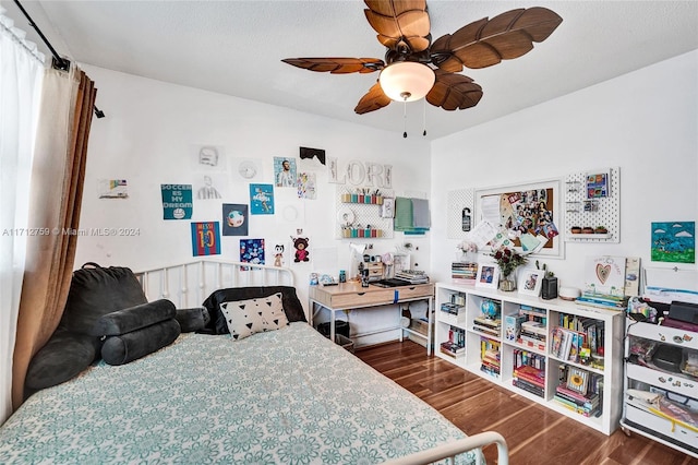 bedroom with ceiling fan and dark hardwood / wood-style flooring