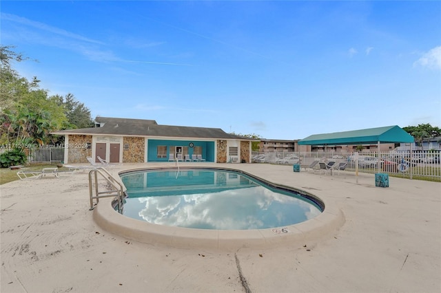 view of swimming pool featuring a patio area