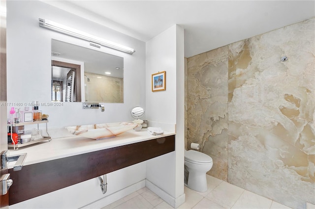 bathroom featuring tile patterned floors and toilet