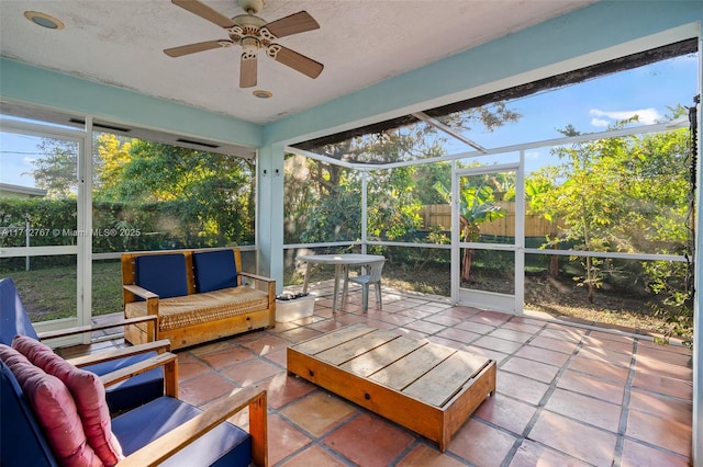 sunroom with ceiling fan