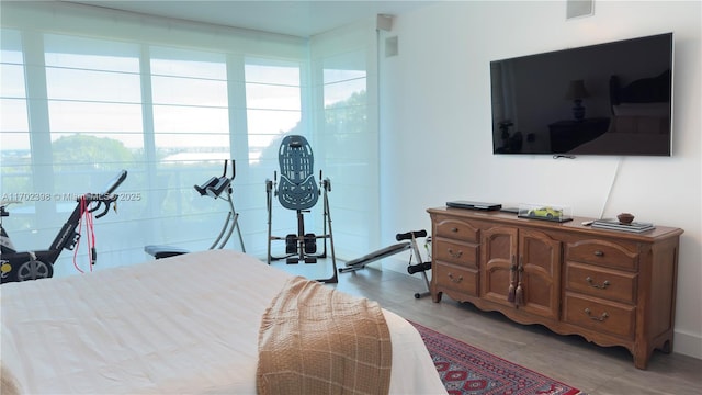 bedroom with light hardwood / wood-style floors