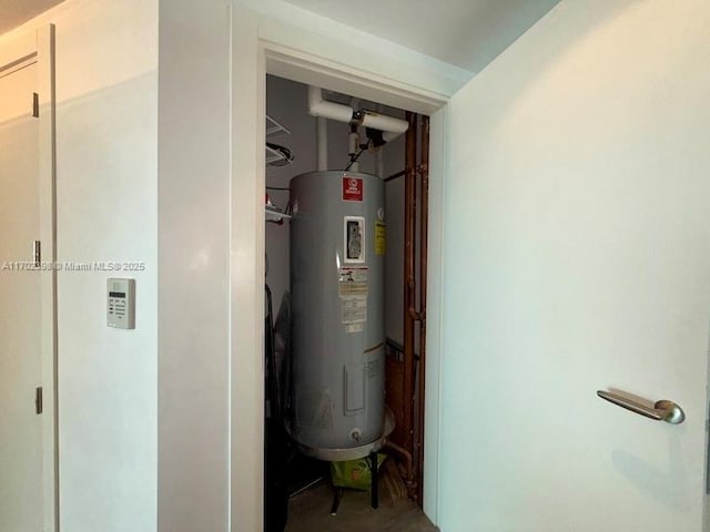 utility room featuring electric water heater