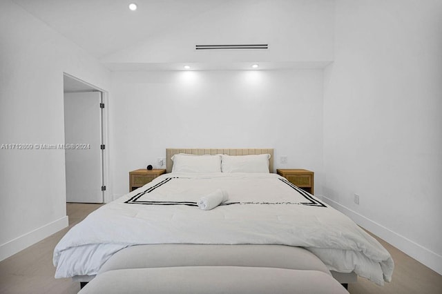 bedroom with vaulted ceiling