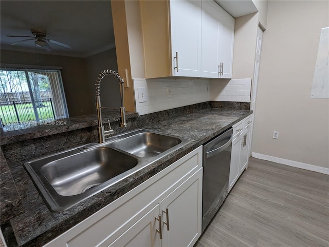 kitchen featuring light wood-type flooring, backsplash, white cabinets, sink, and dishwasher