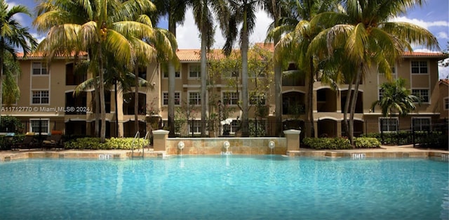 view of pool with pool water feature