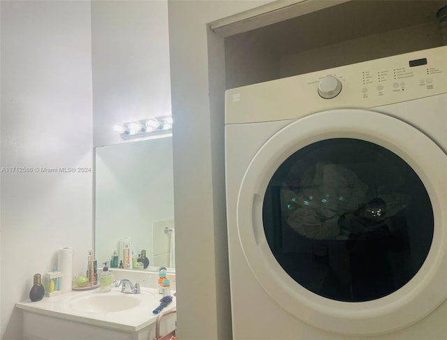 laundry room with washer / clothes dryer and sink