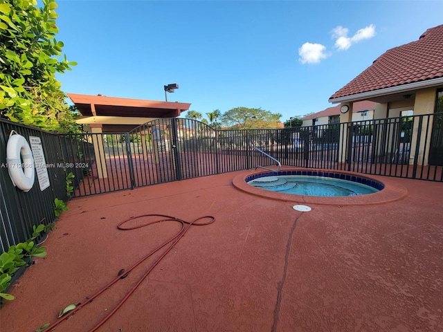 view of pool with a community hot tub