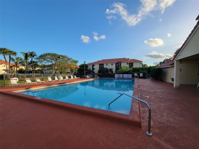 view of swimming pool featuring a patio area