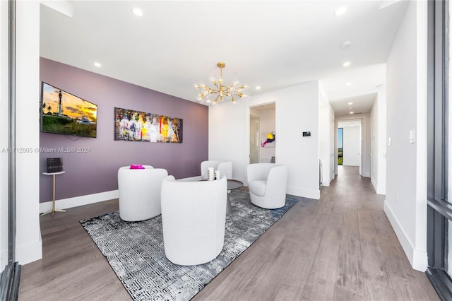 living room featuring a chandelier and hardwood / wood-style flooring