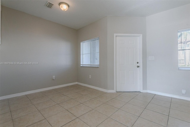 view of tiled spare room