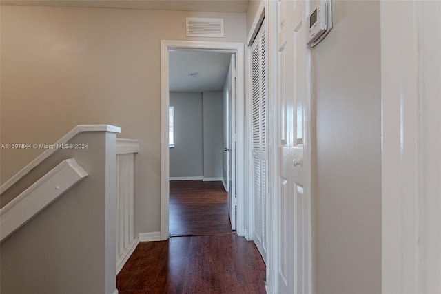 hall with dark hardwood / wood-style flooring