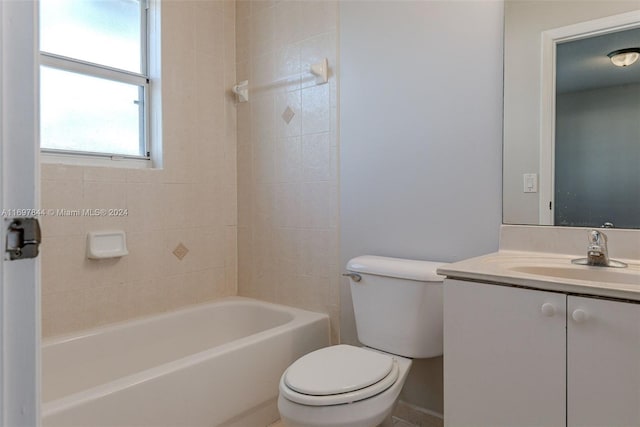 full bathroom featuring vanity, toilet, and tiled shower / bath