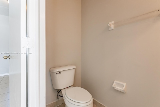 bathroom featuring tile patterned flooring and toilet