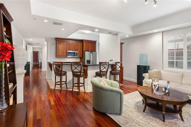 living room featuring dark hardwood / wood-style floors