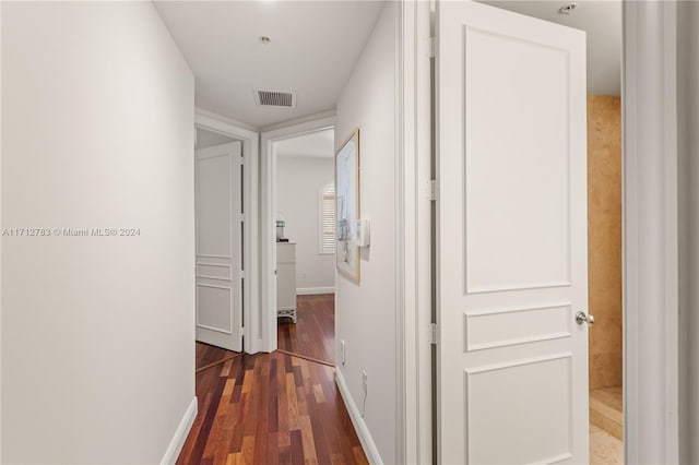 hall with dark hardwood / wood-style flooring