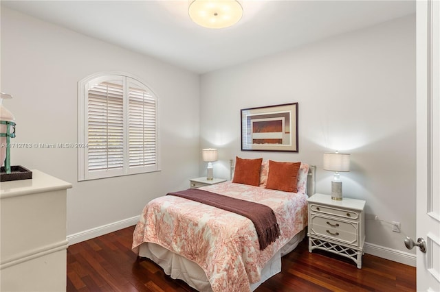 bedroom featuring dark hardwood / wood-style floors