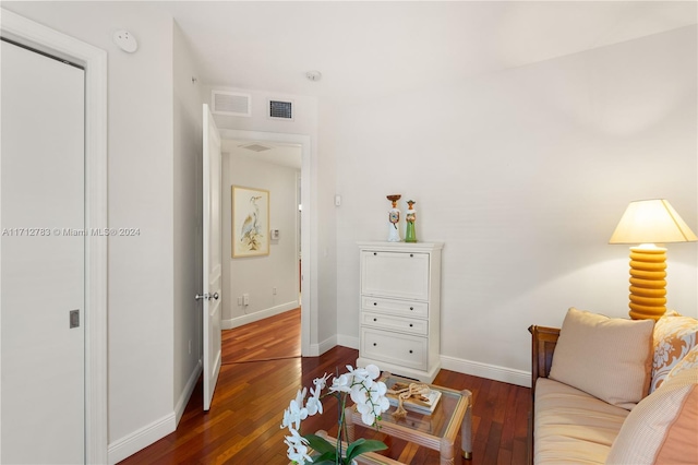 living room with dark hardwood / wood-style flooring