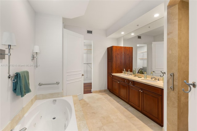 bathroom featuring vanity and independent shower and bath