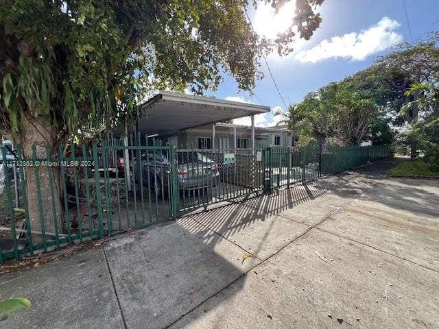 exterior space with a carport