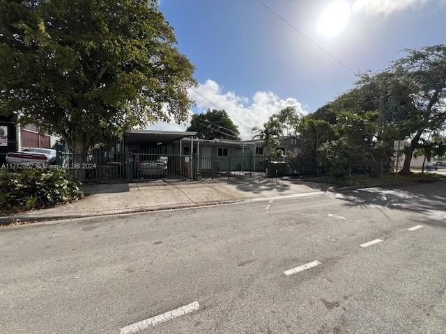 view of front facade with a carport