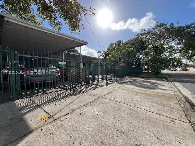 view of gate featuring a carport