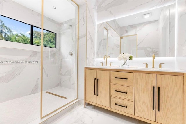 bathroom featuring tiled shower and vanity