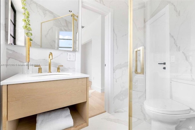 bathroom with vanity, toilet, and an enclosed shower