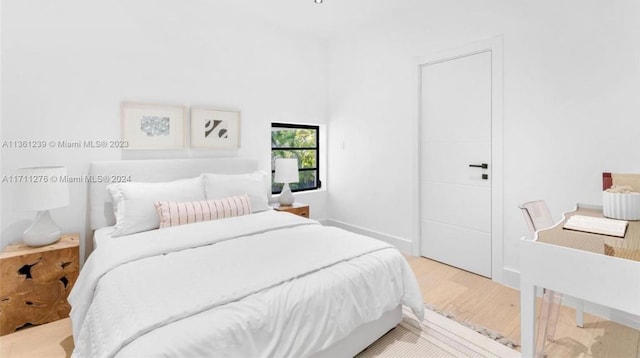 bedroom featuring light wood-type flooring