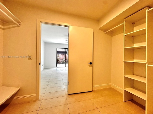 spacious closet featuring tile patterned floors