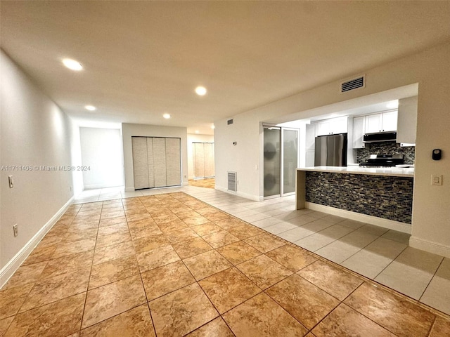 interior space with light tile patterned flooring