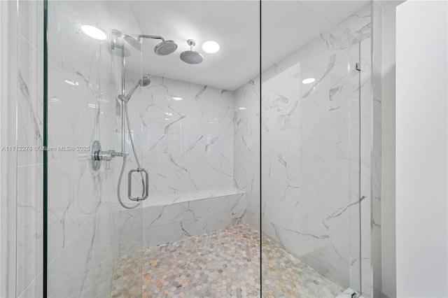 bathroom with a shower with shower door