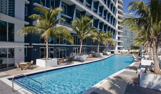 view of swimming pool with a patio