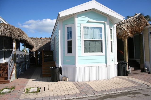 view of side of home featuring a patio area