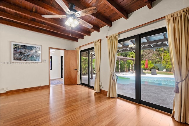 entryway featuring beamed ceiling, light hardwood / wood-style flooring, ceiling fan, and wooden ceiling