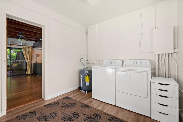 laundry area with wood-type flooring, electric water heater, washer and clothes dryer, and ceiling fan