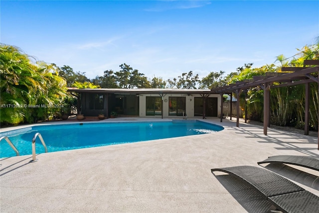 view of pool featuring a patio area and a pergola