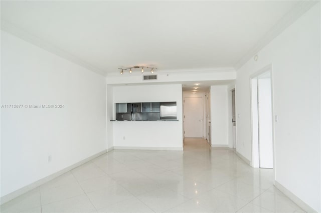 unfurnished living room featuring ornamental molding