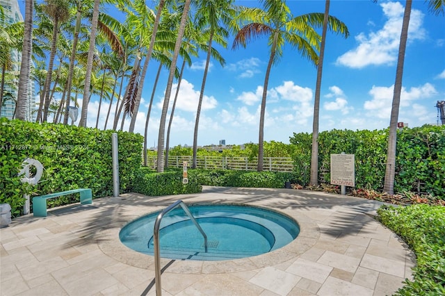 view of pool with a community hot tub