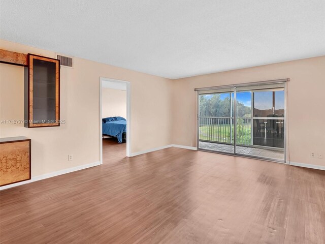 spare room featuring hardwood / wood-style floors