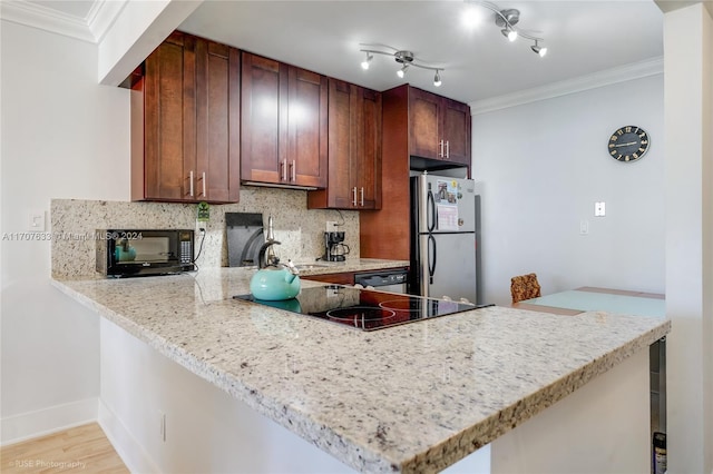 kitchen with ornamental molding, kitchen peninsula, and stainless steel refrigerator