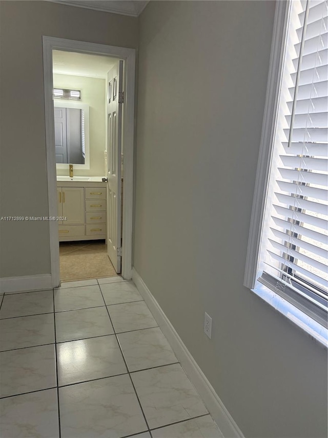 hallway featuring crown molding