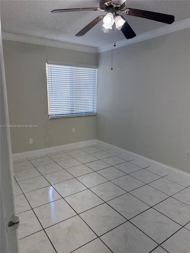 unfurnished room featuring ornamental molding, a textured ceiling, and light tile patterned floors