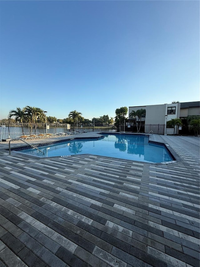 view of swimming pool featuring a patio