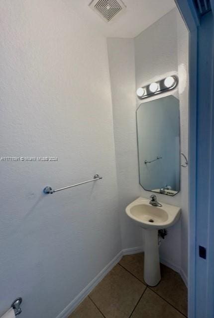 bathroom with tile patterned floors and sink