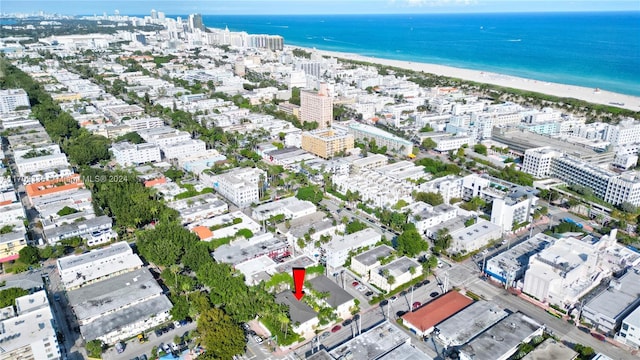 aerial view featuring a water view and a view of the beach