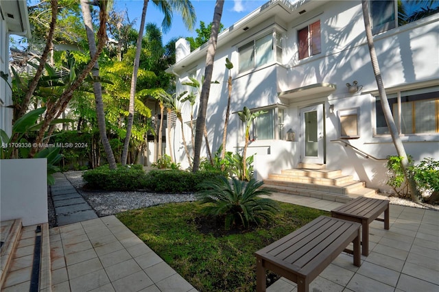 view of home's community featuring a patio area